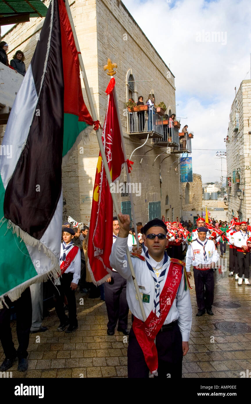 Palestinian Authority Bethlehem near Manger Square scouts band marching with palestinian flag vertical Stock Photo