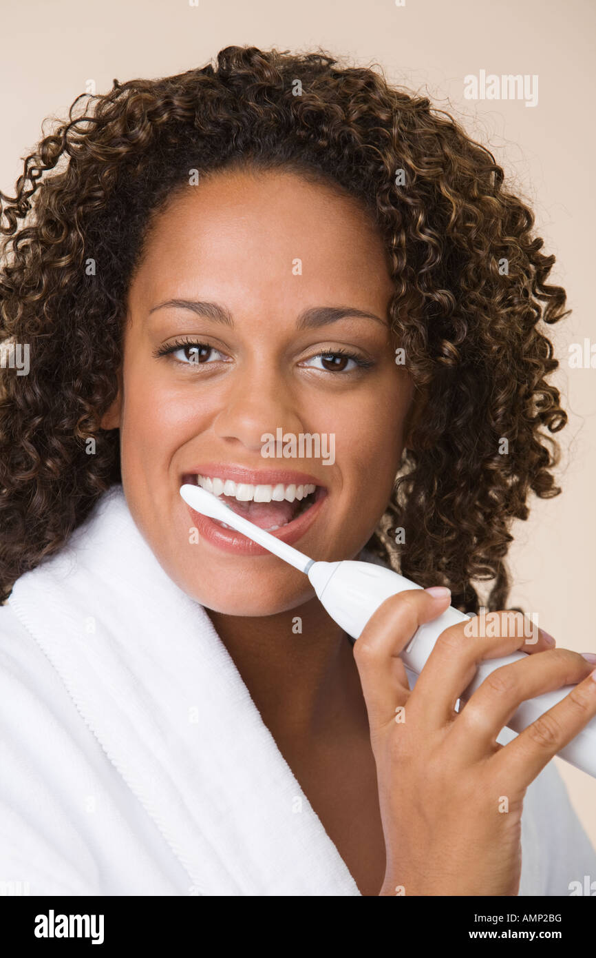 African woman brushing teeth Stock Photo