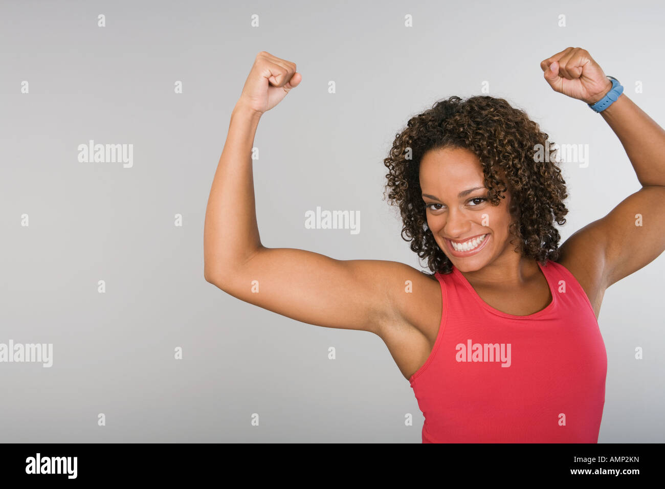African american woman flexing bicep hi-res stock photography and