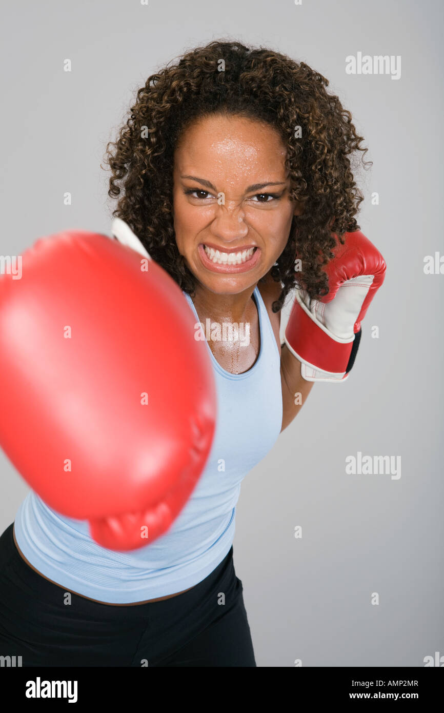 African woman wearing boxing gloves Stock Photo