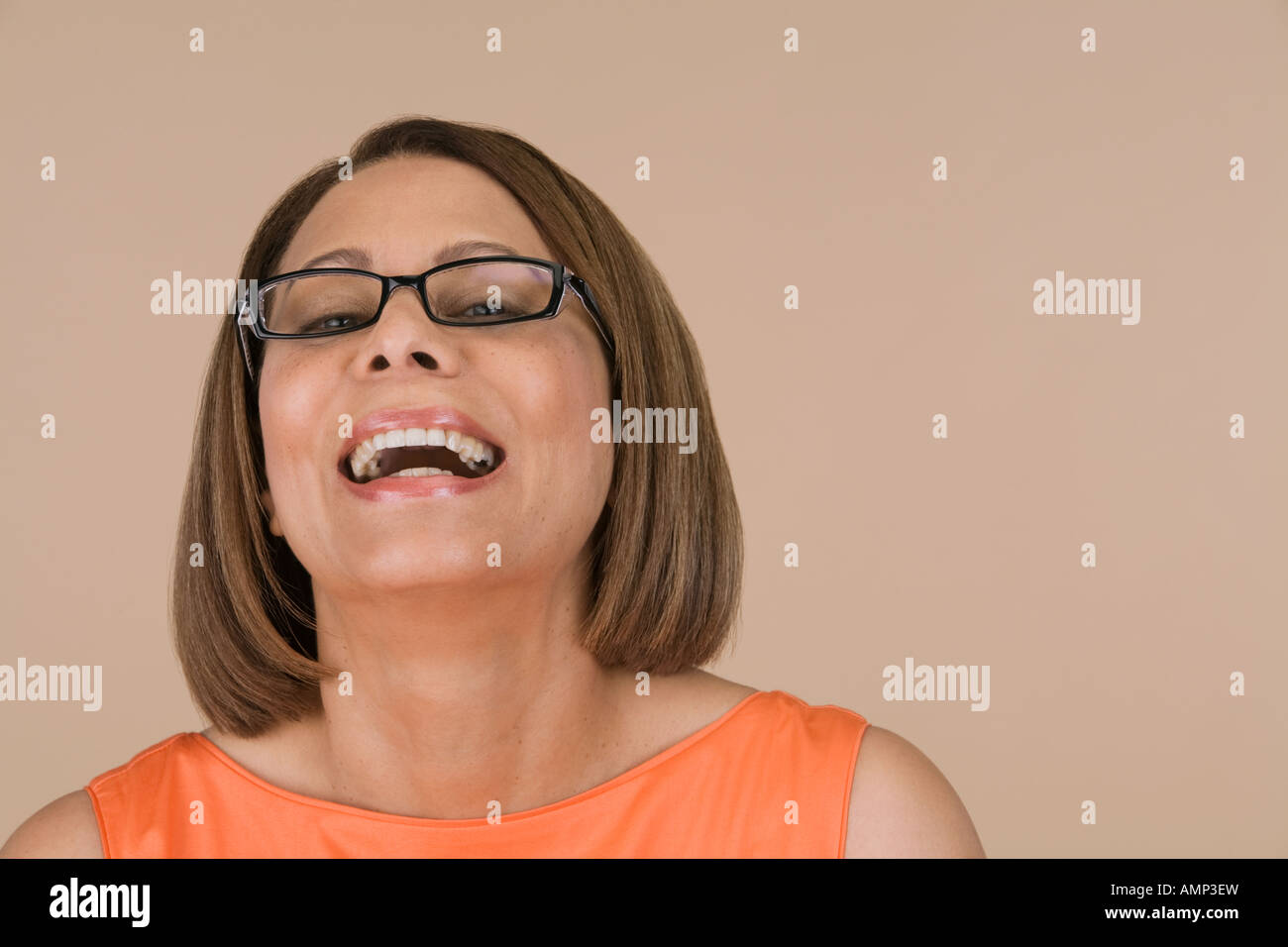 Laughing woman wearing orange hi-res stock photography and images - Alamy