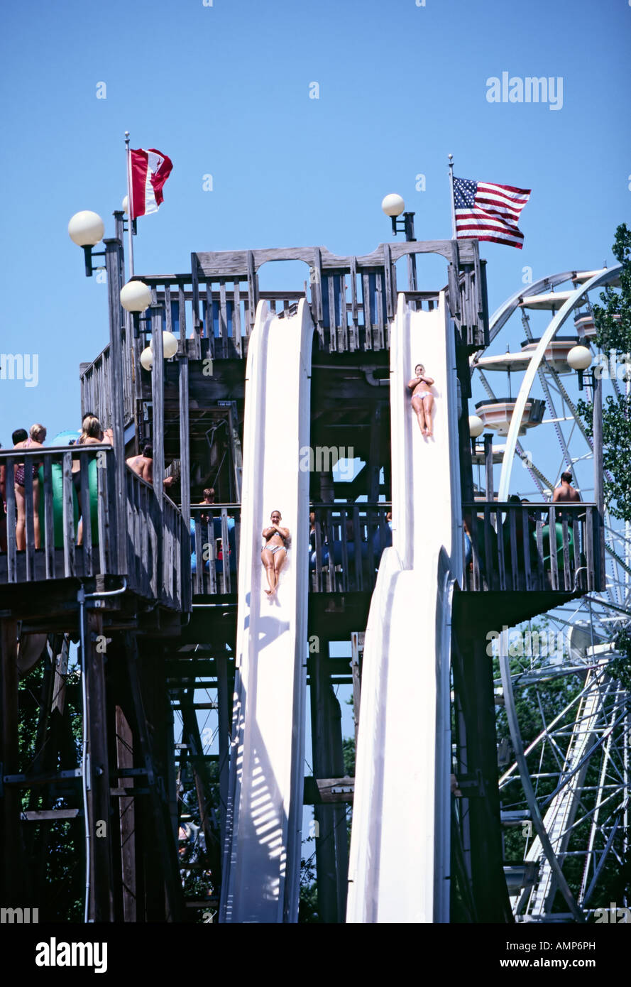 Two women slide down the twin water slides at Waldameer Water World in