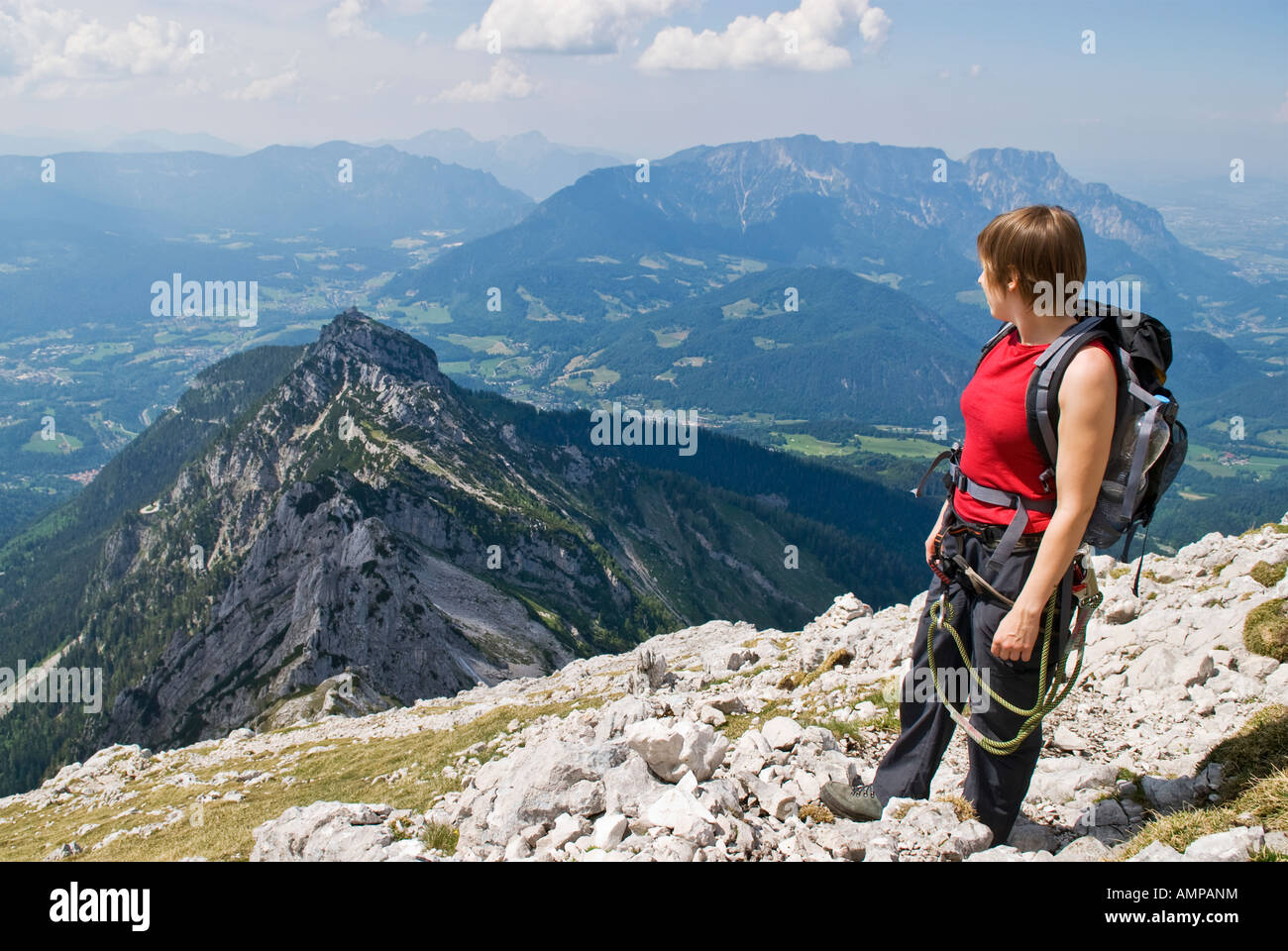Female hiker enjoying view of Berchtesgaden and the German Alps Stock ...