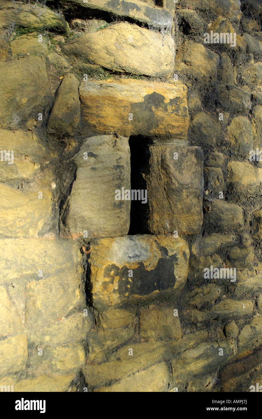 Arrow slits in the wall at Burradon Tower, Northumberland, England. Stock Photo