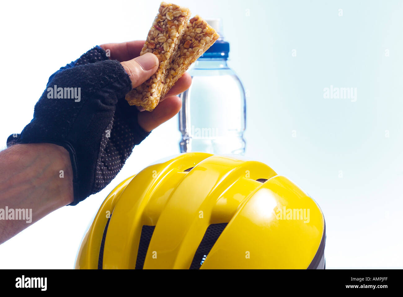 biker holding a granola-bar Stock Photo