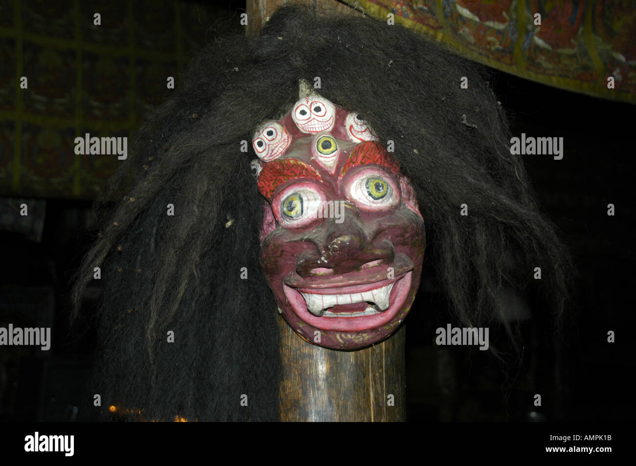 Horrible friendly mask in monastery Thare Gompa Khangsar Annapurna Region Nepal Stock Photo