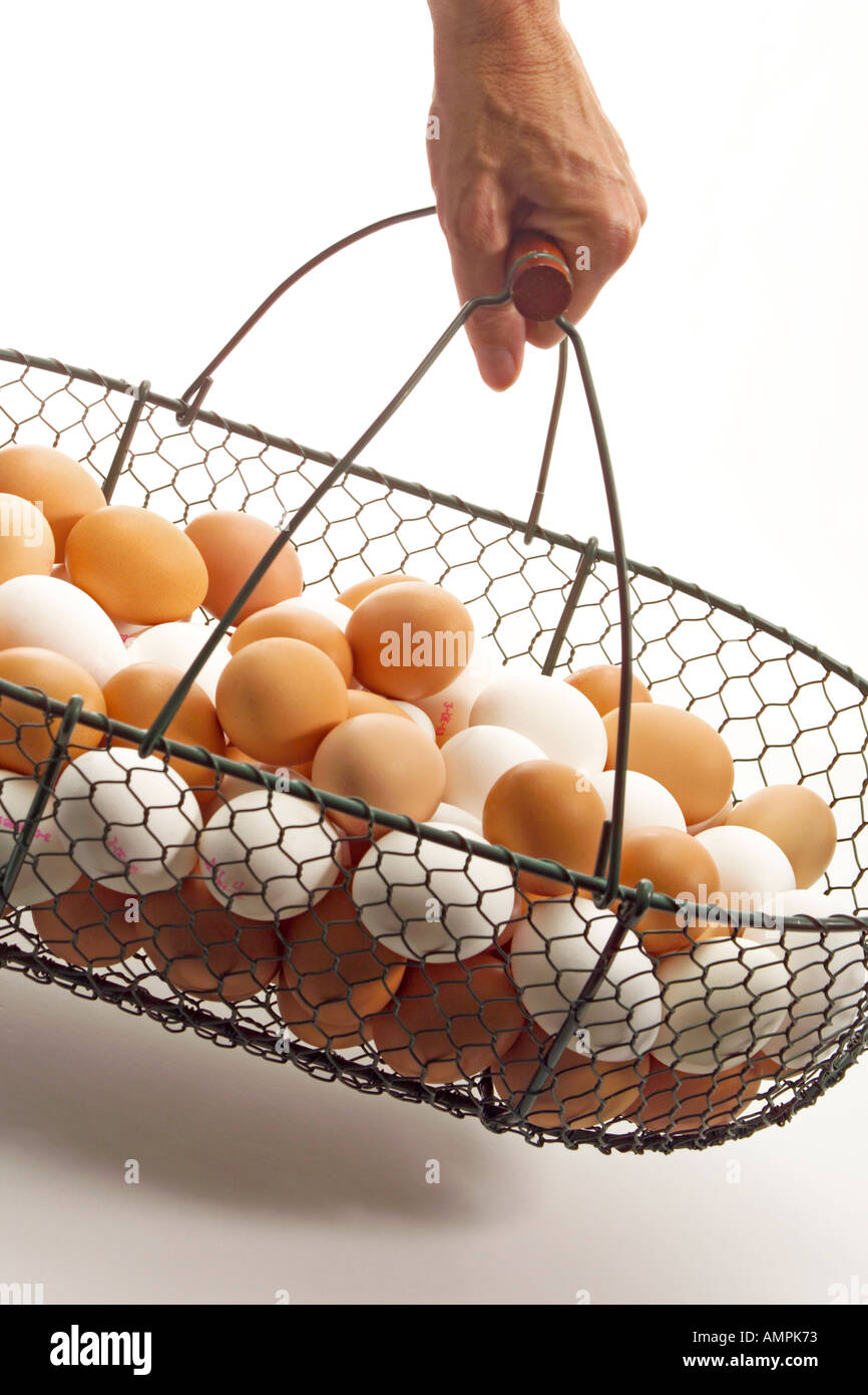 Basket with fresh eggs Stock Photo
