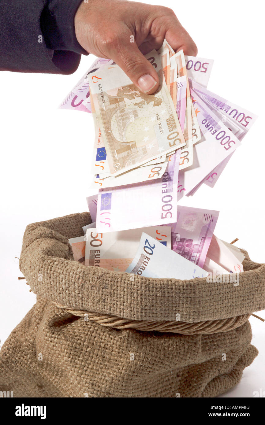 Man taking money from sack Stock Photo