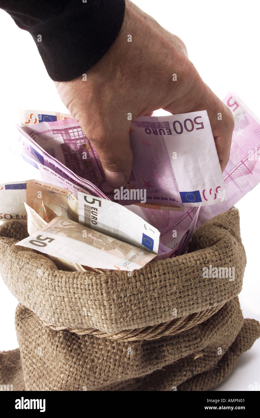 Man taking money from sack Stock Photo
