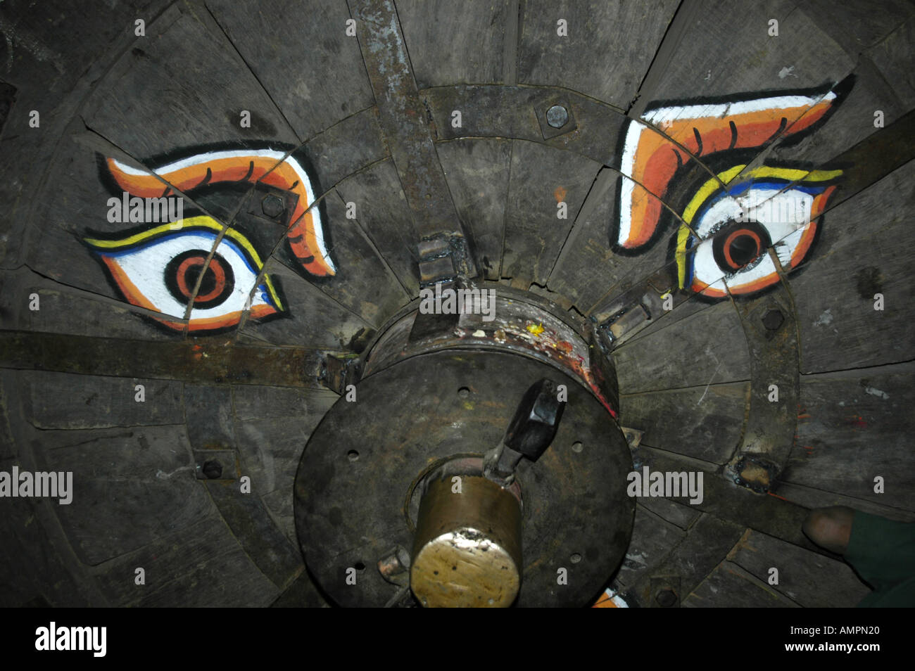 Painted pair of eyes on a wooden wheel Kathmandu Nepal Stock Photo