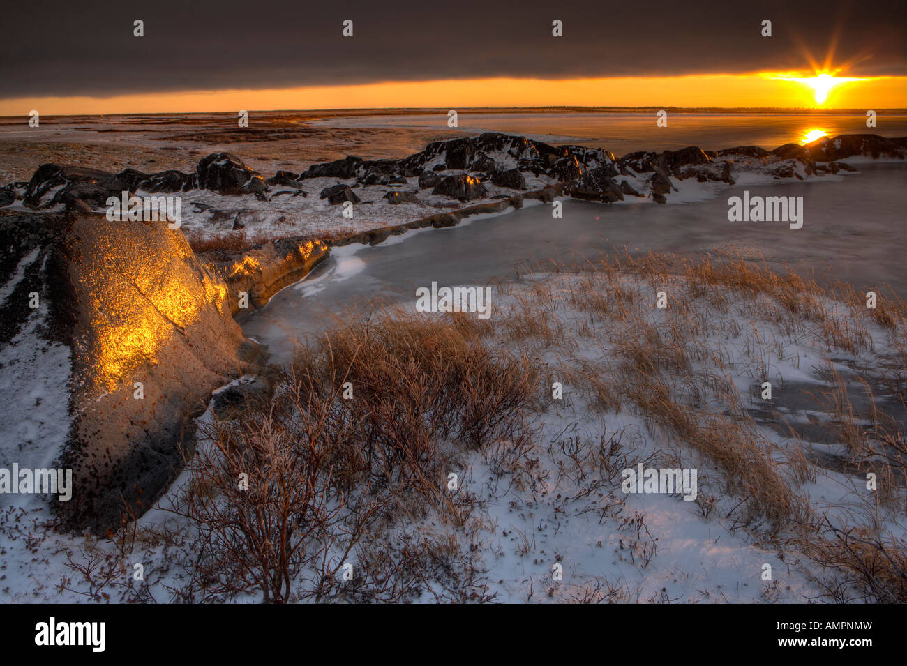 Sunset over rocky coastline hi-res stock photography and images - Alamy