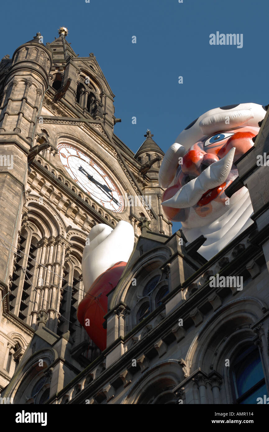 large blow up Father Christmas on Manchester city hall Stock Photo Alamy