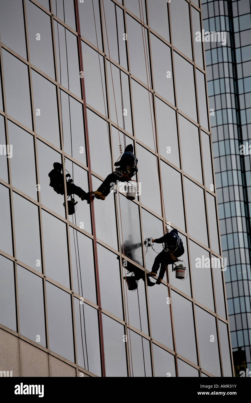 Two men cleaning skyscrapers windows hi-res stock photography and