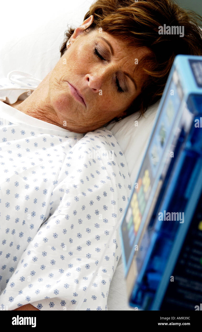 Patient in hospital bed Stock Photo