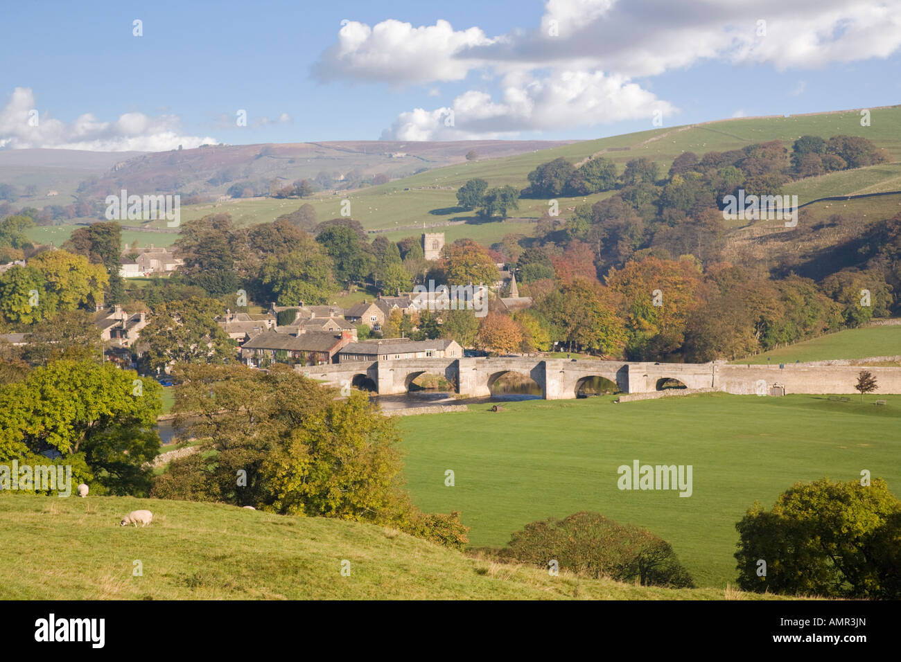 English landscape view to River Wharfe and bridge in Yorkshire Dales National Park Pennines in autumn. Burnsall Wharfedale Yorkshire England UK Stock Photo