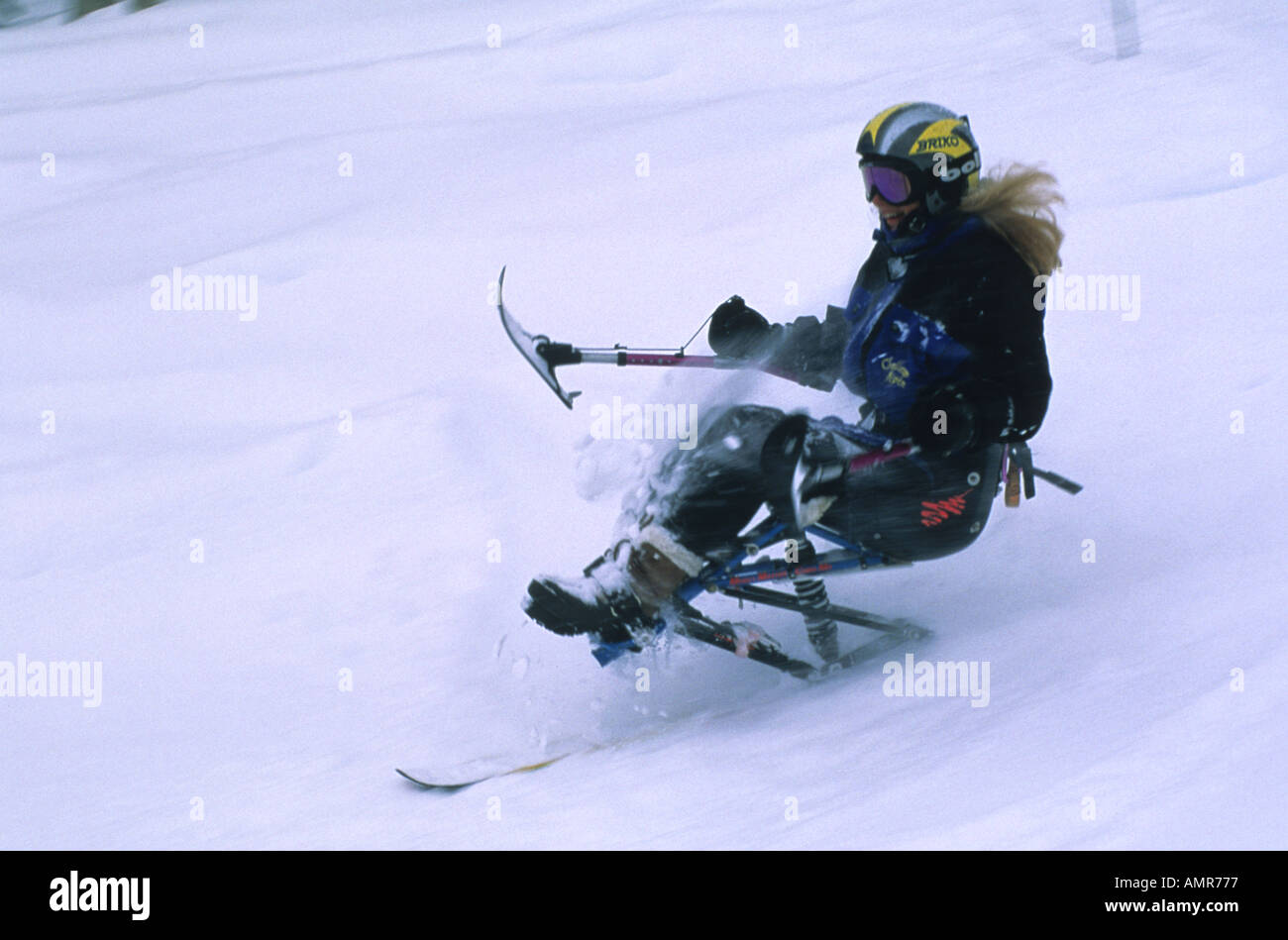 Snowmass Village Challenged handicapped skier on a mono ski ski down a snow covered slope  Stock Photo