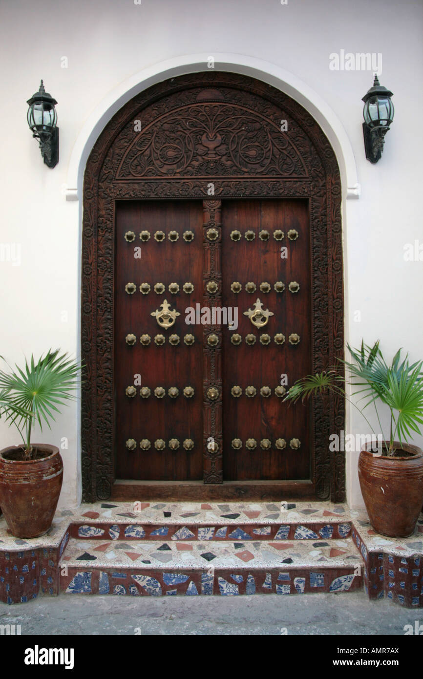 One of the many decorative wooden doors in Stone Town on the island of Zanzibar Tanzania Africa Stock Photo