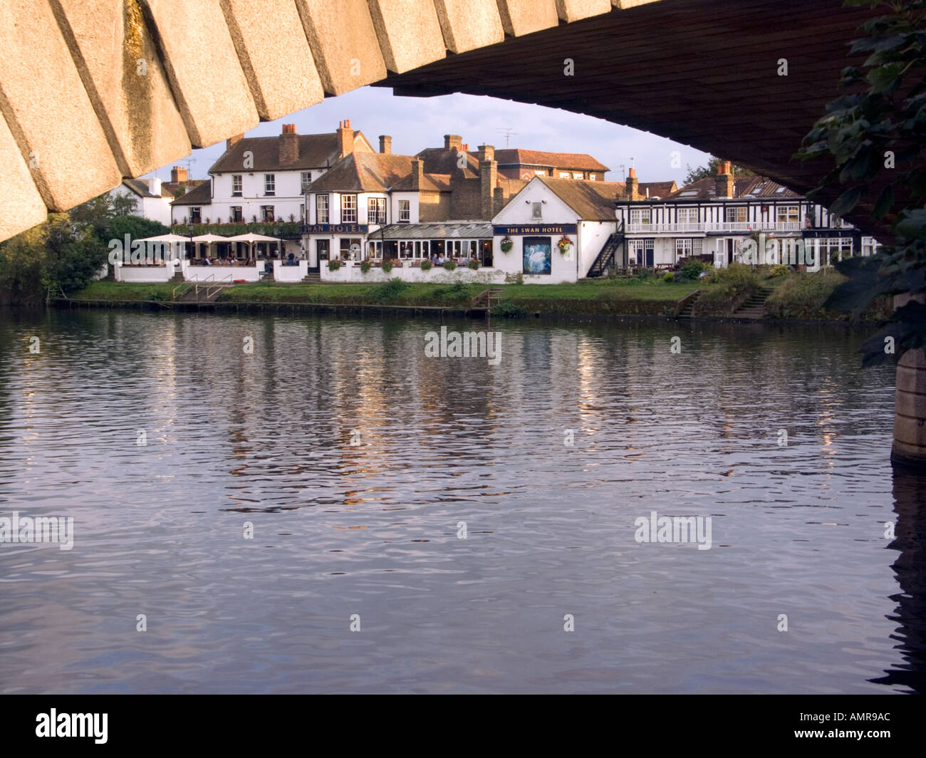 The Swan Hotel viewed through an arch of Stains Bridge in the evening