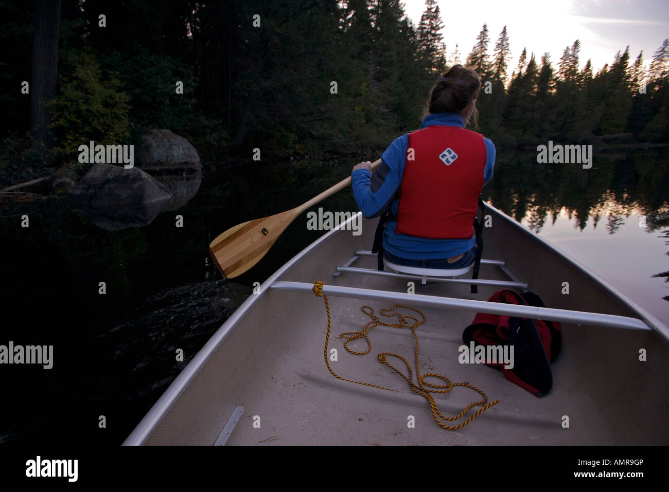 Paddling a canoe along a river between Whitefish Lake and Rock Lake in Algonquin Provincial Park
