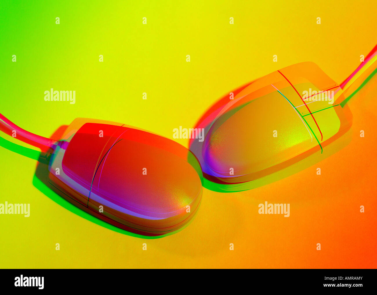 Two computer mouses in colored light Stock Photo Alamy