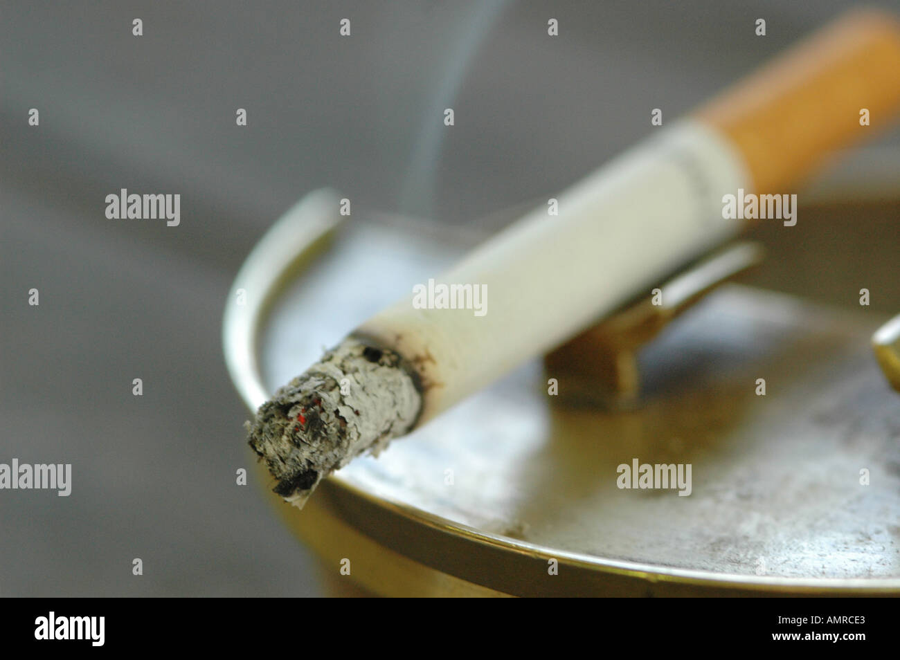 Burning cigarette in ashtray, close-up Stock Photo