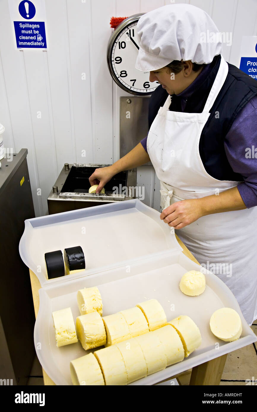 Woman dipping cheese in wax for specialist cheese packaging UK Stock Photo