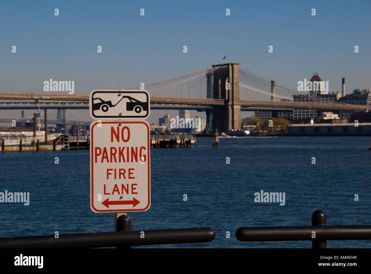 No Parking Sign New York City with the Brooklyn Bridge In the background Stock Photo