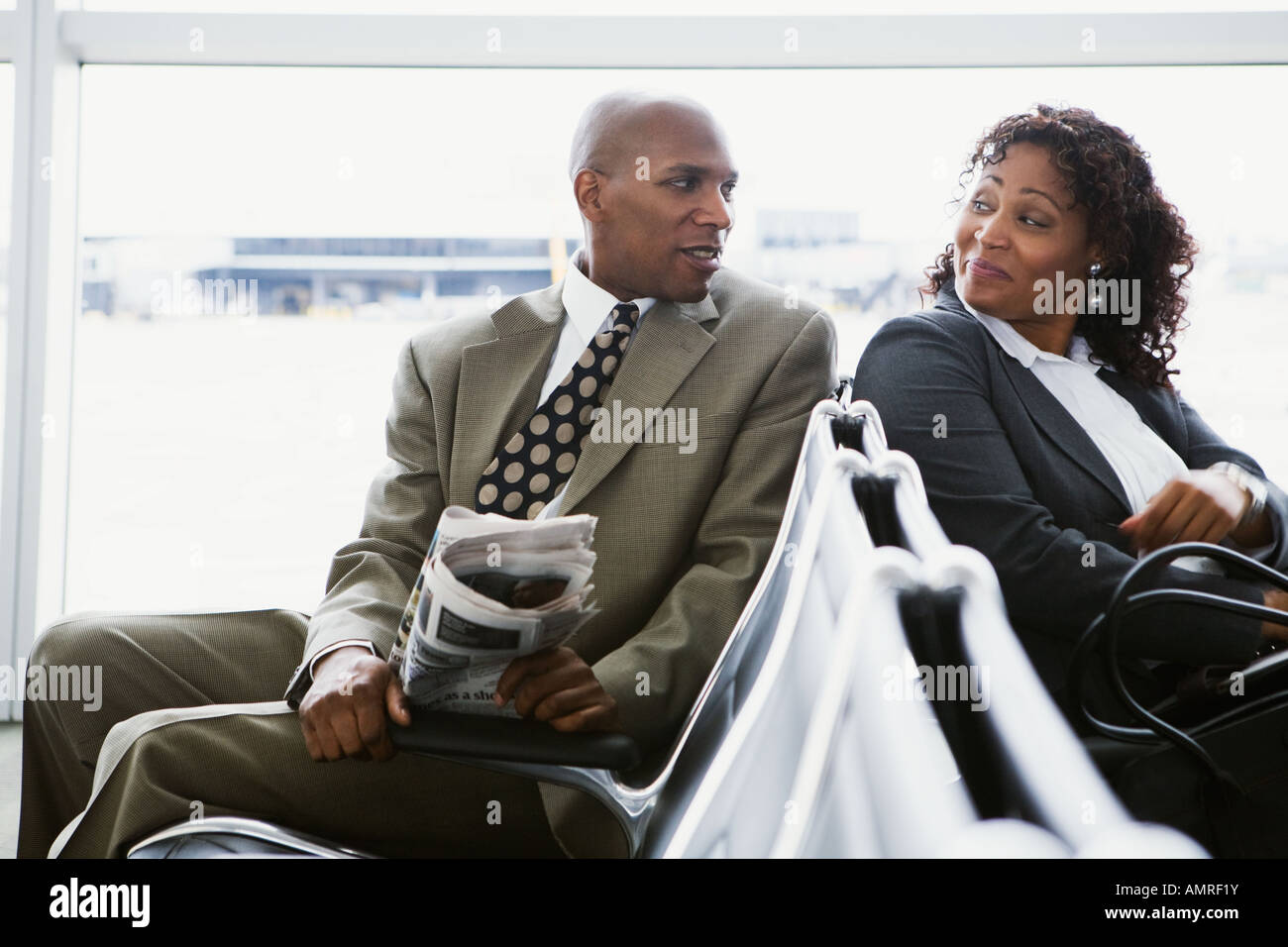 African businesspeople in airport waiting area Stock Photo
