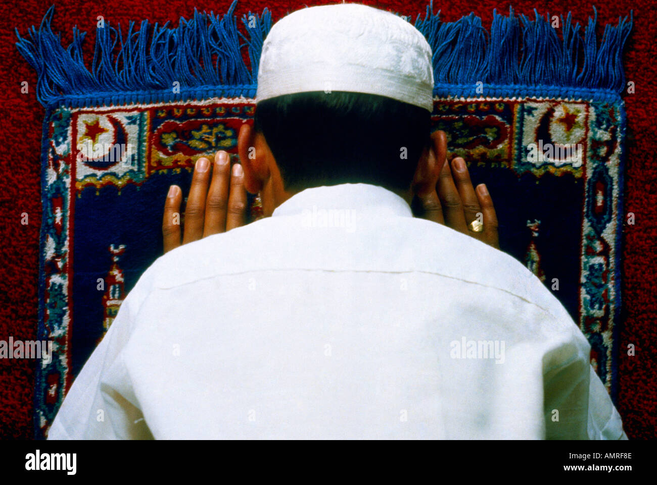 Saudi Arabia Boy Praying bowing on Prayer Rug Stock Photo Alamy