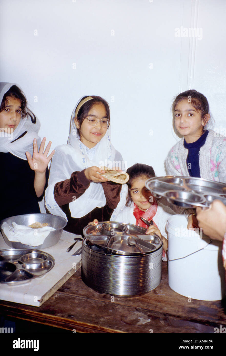 Girls Serving Langar at Gurdwara Southall London England Stock Photo