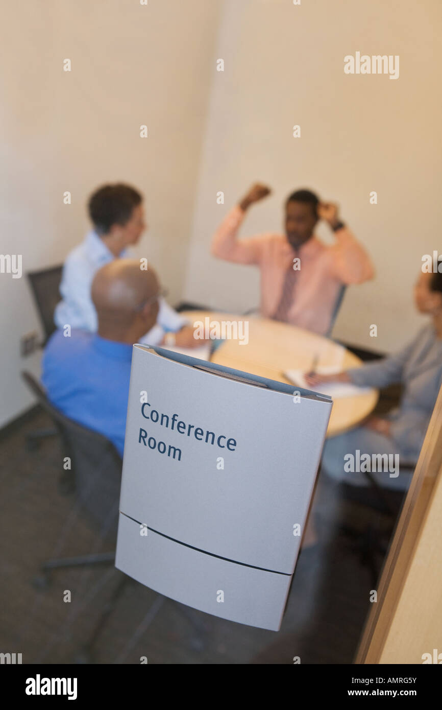 Businesspeople at meeting in conference room Stock Photo