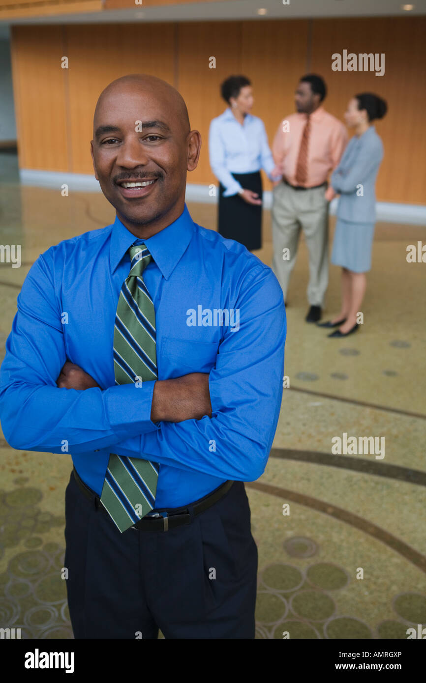 African businessman with arms crossed Stock Photo