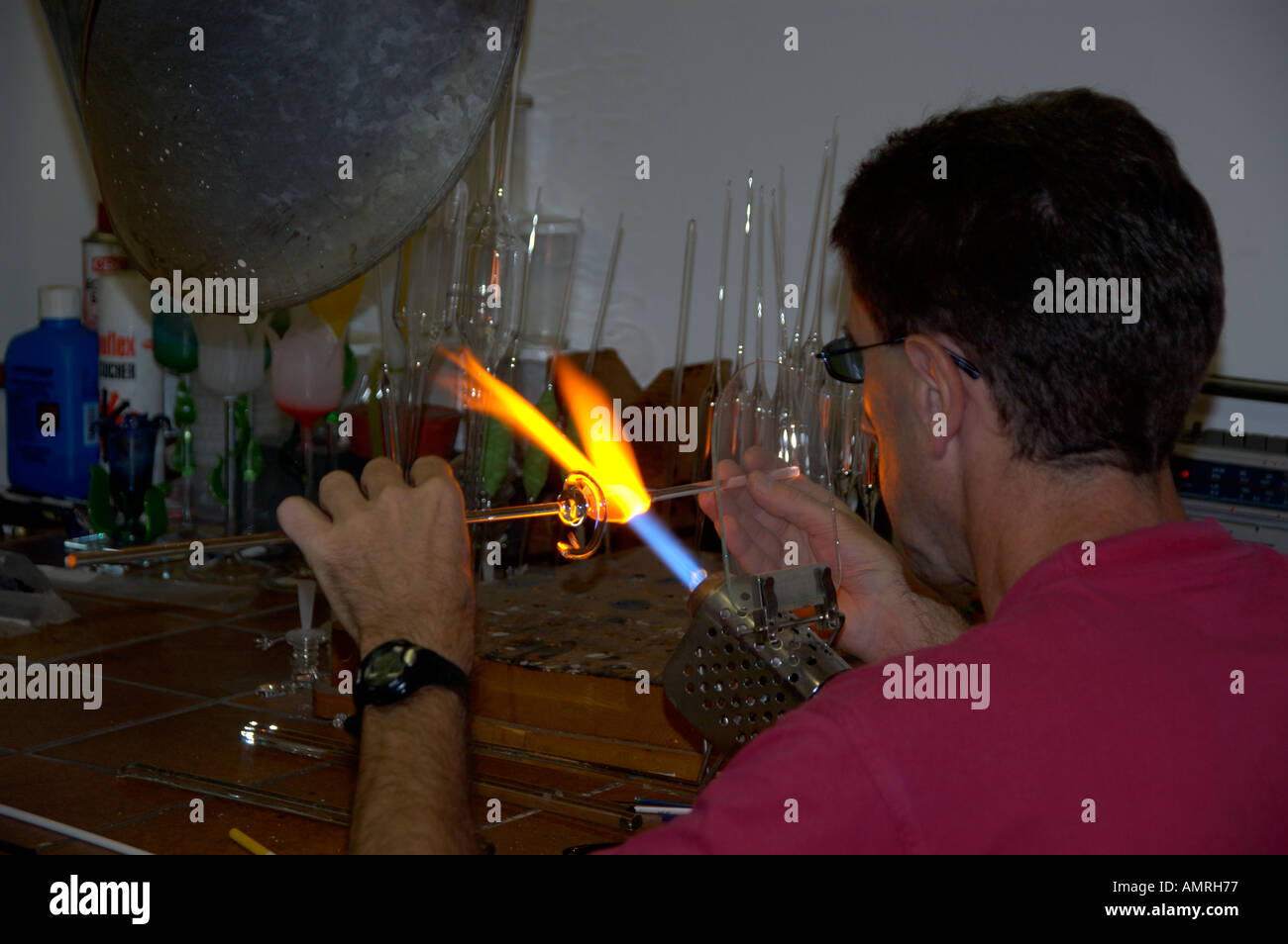 Glass artist at work melting glass with a flame factory Joska Bodenmais Bayerischer Wald Lower Bavaria Germany Stock Photo