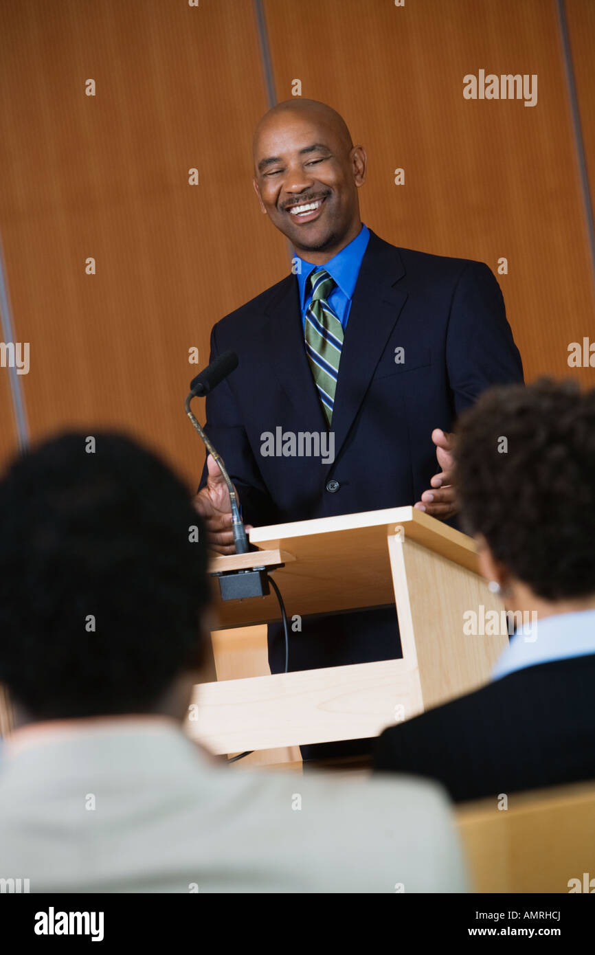 African businessman giving lecture Stock Photo