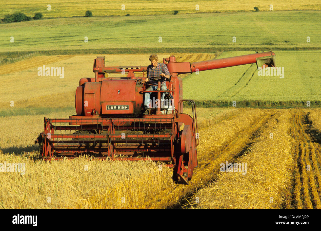 Old combine harvester, Salisbury Plain, Wiltshire, UK Stock Photo Alamy