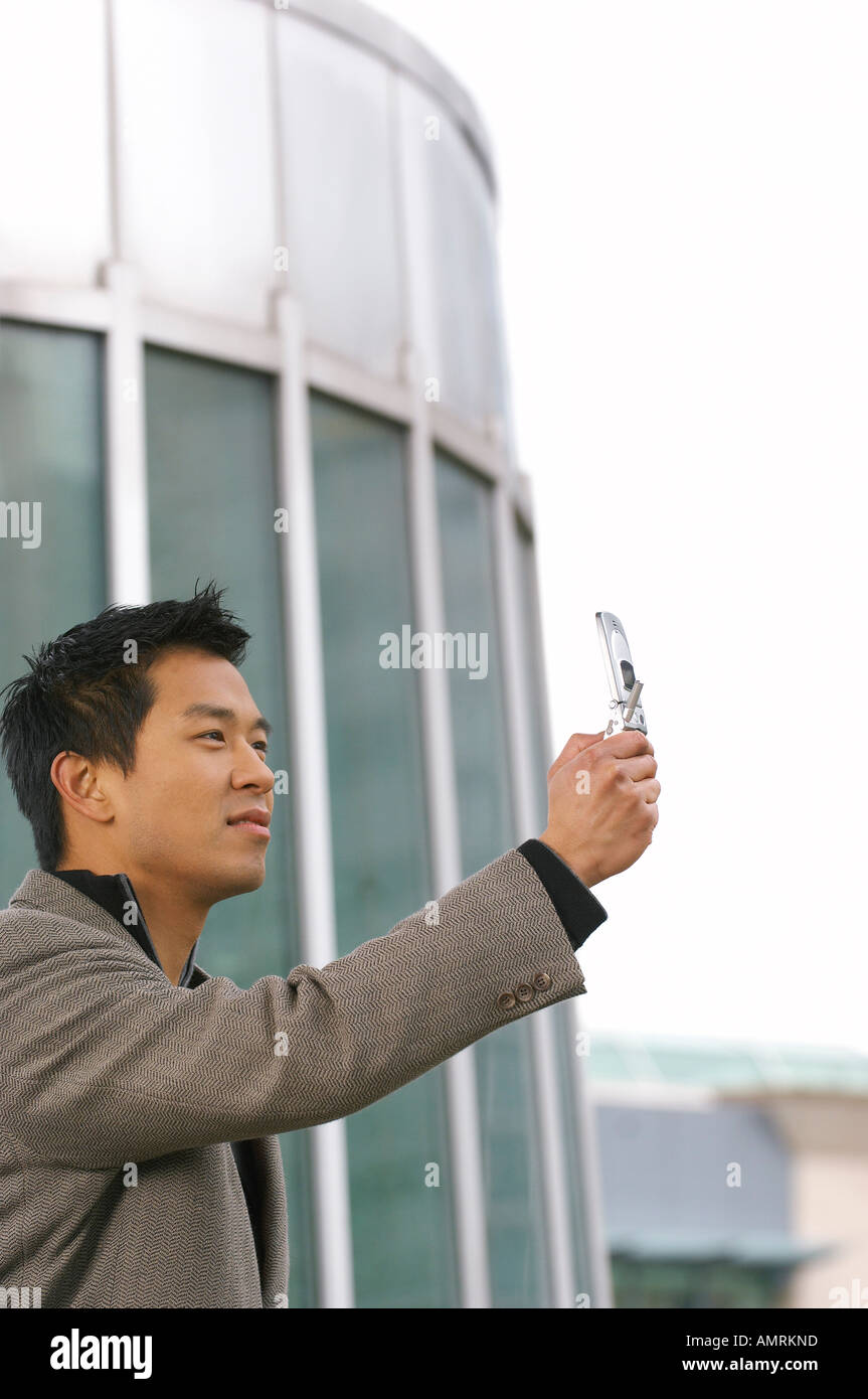 Man Taking Photo With Cell Phone Stock Photo