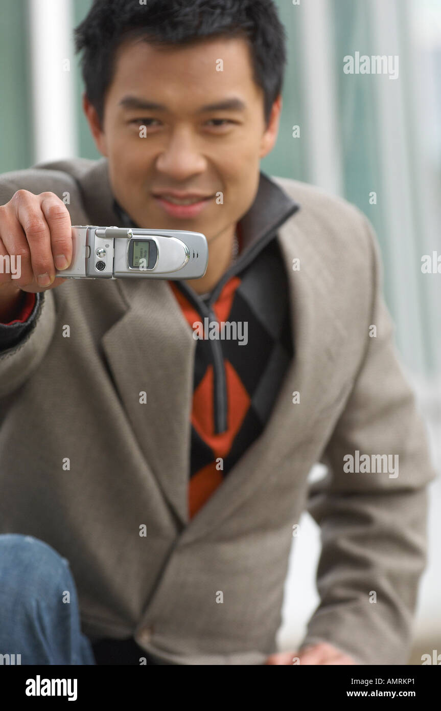 Man Taking Photo With Cell Phone Stock Photo