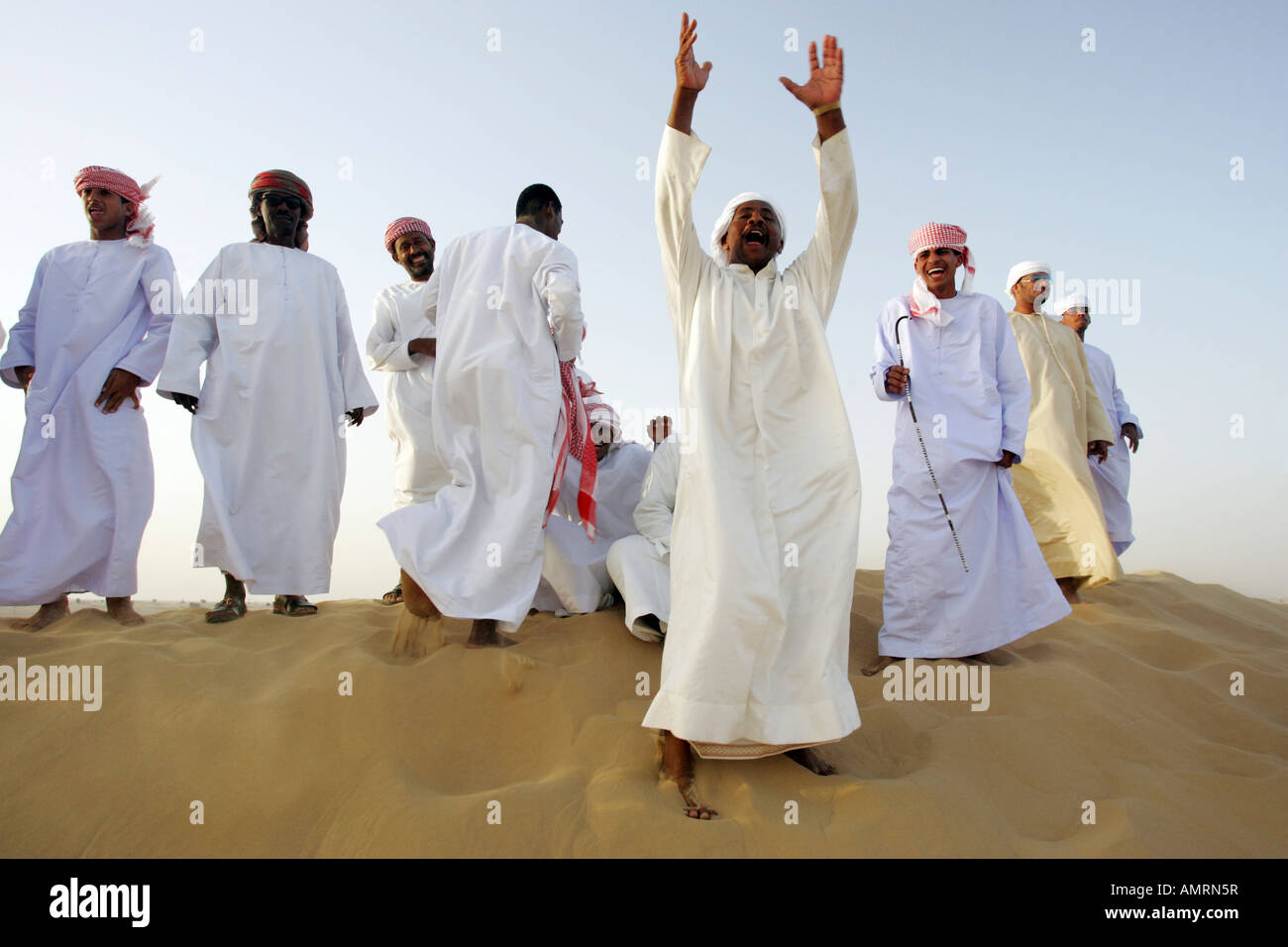 Group of Arab men in the desert Stock Photo