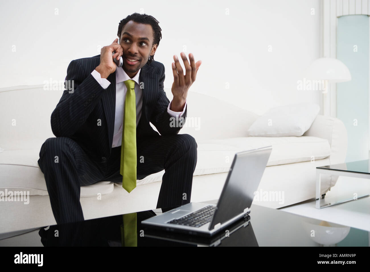 African businessman talking on cell phone Stock Photo