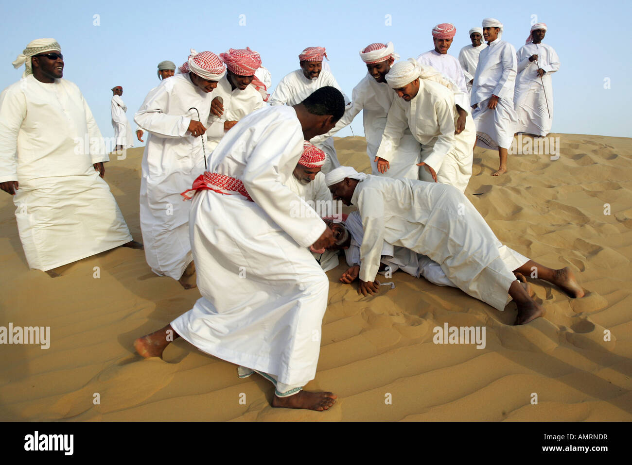 Arab men in the desert Stock Photo 