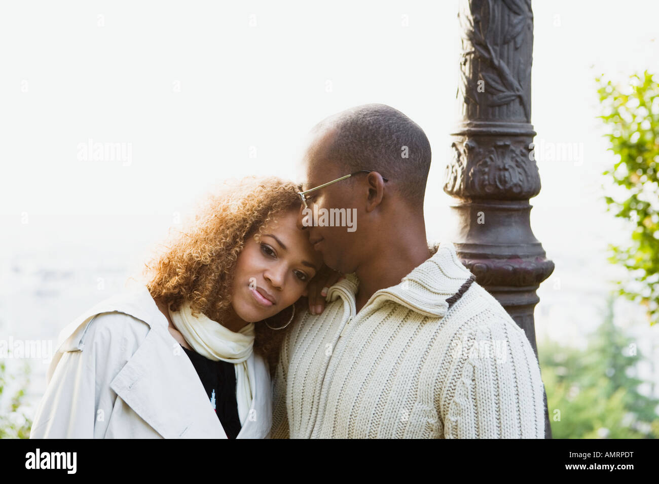 African couple hugging Stock Photo