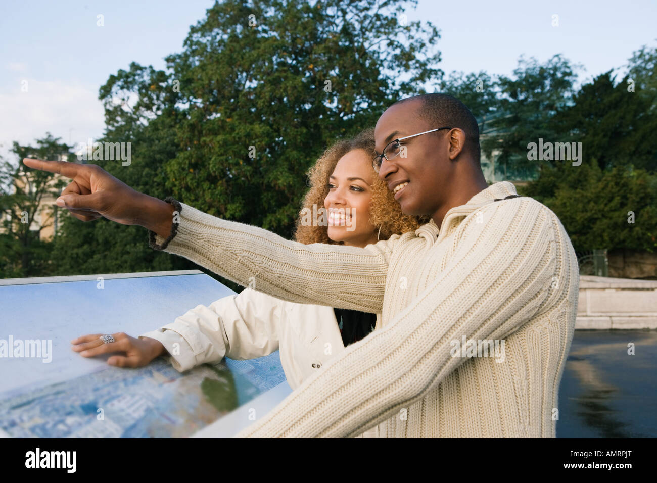 African couple pointing Stock Photo - Alamy