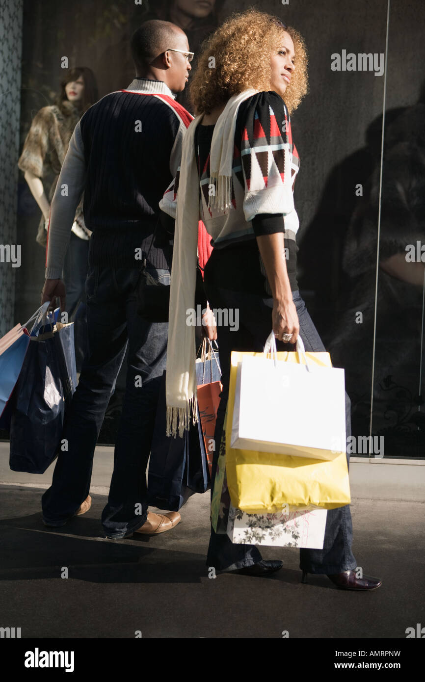 African couple holding shopping bags Stock Photo