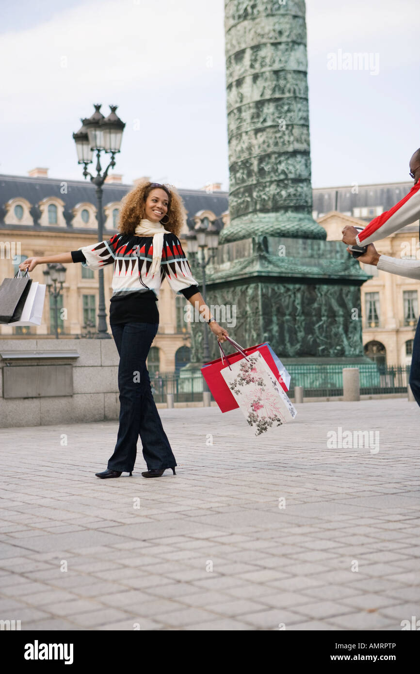 Tourist with shopping bags, Paris, France Stock Photo