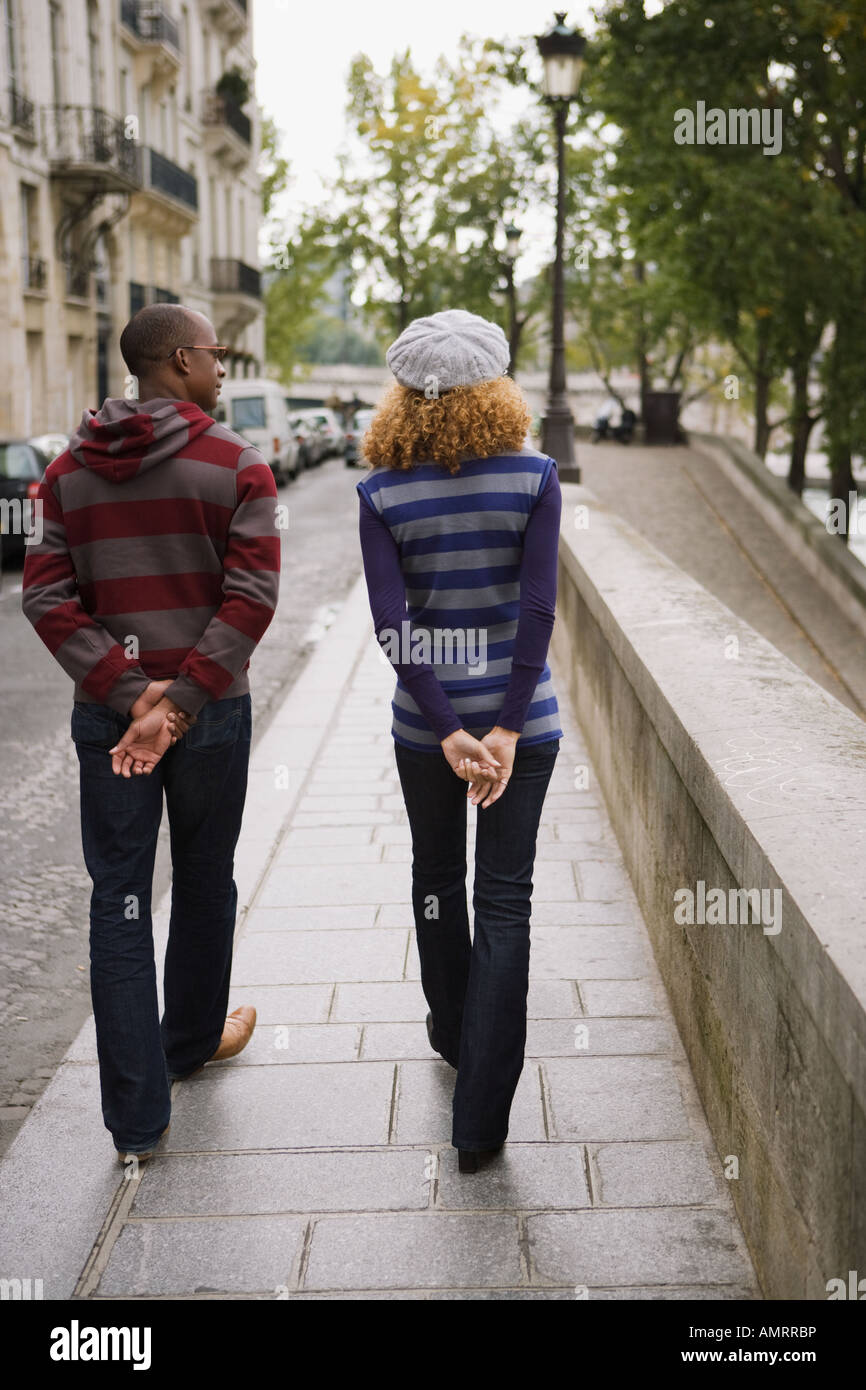 Rear view of African couple walking Stock Photo - Alamy