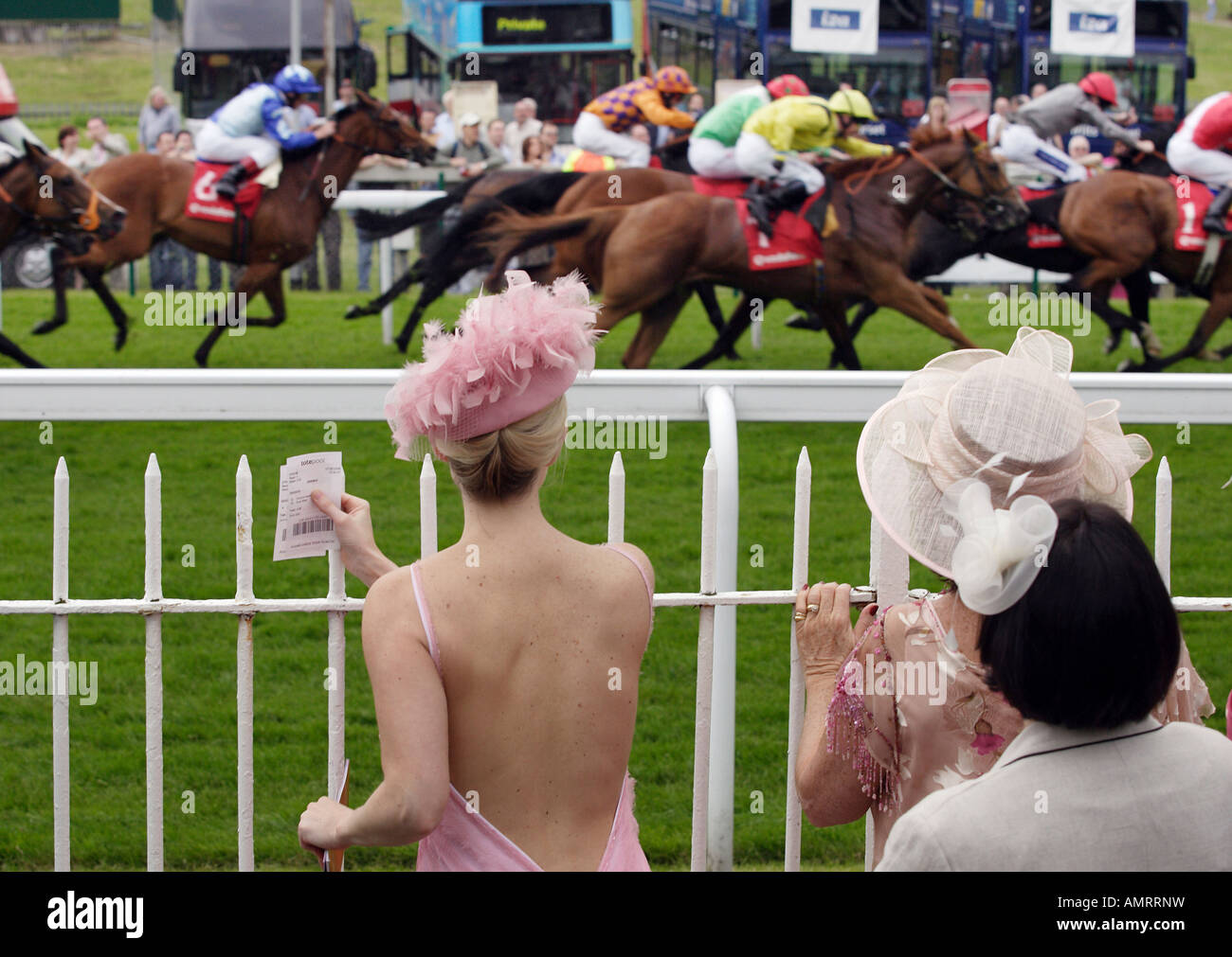 Women watching a horse race, Epsom, Great Britain Stock Photo
