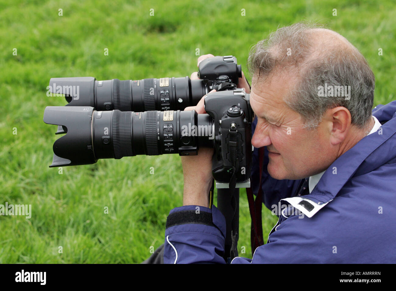 Photographer taking pictures at a horce race, Epsom, Great Britain Stock Photo