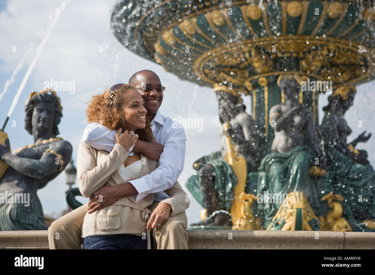 African couple hugging Stock Photo
