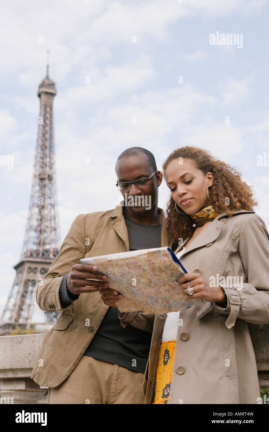 African couple looking at map Stock Photo