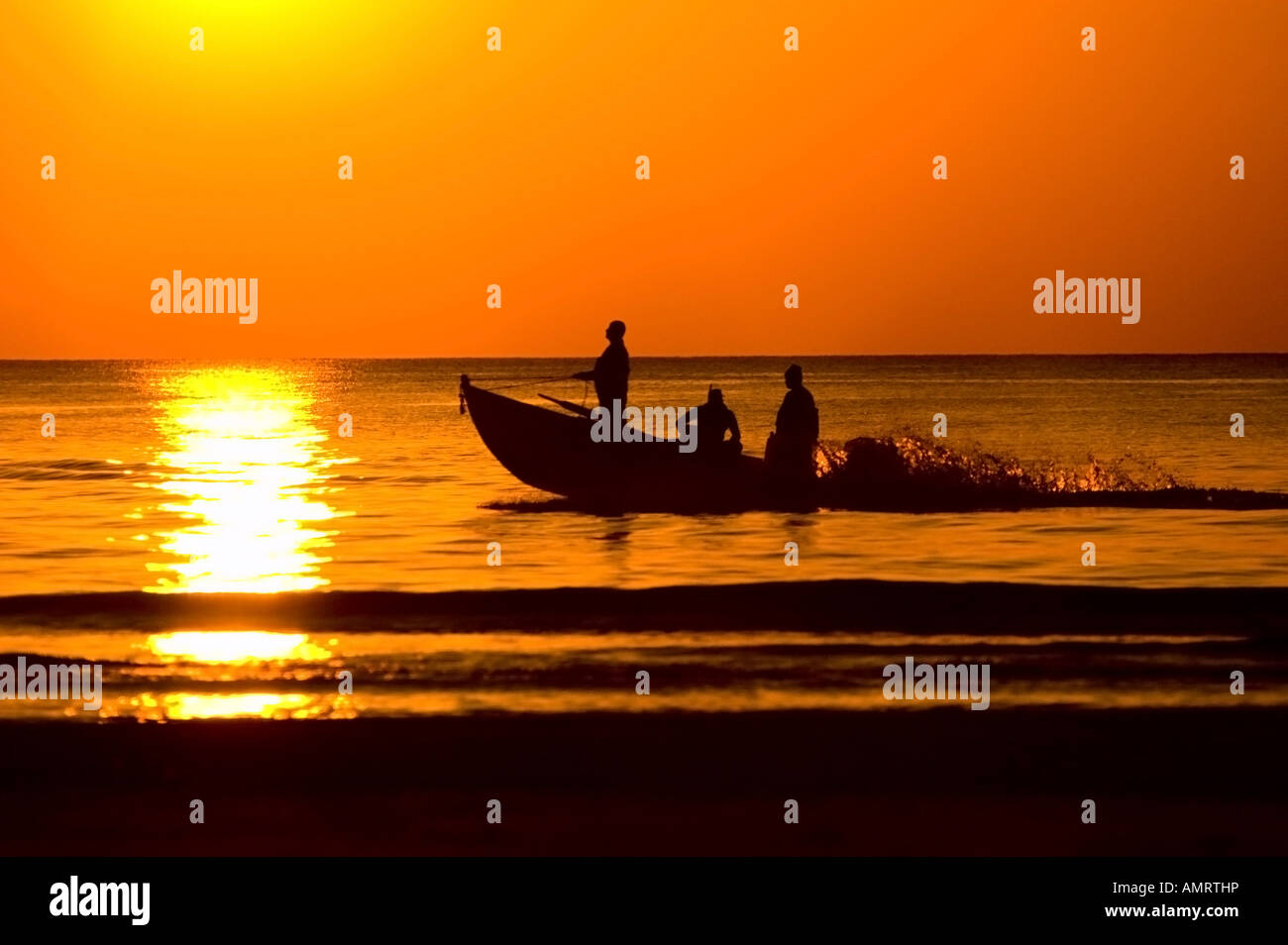 Fishing boat in sunset sea hi-res stock photography and images - Alamy